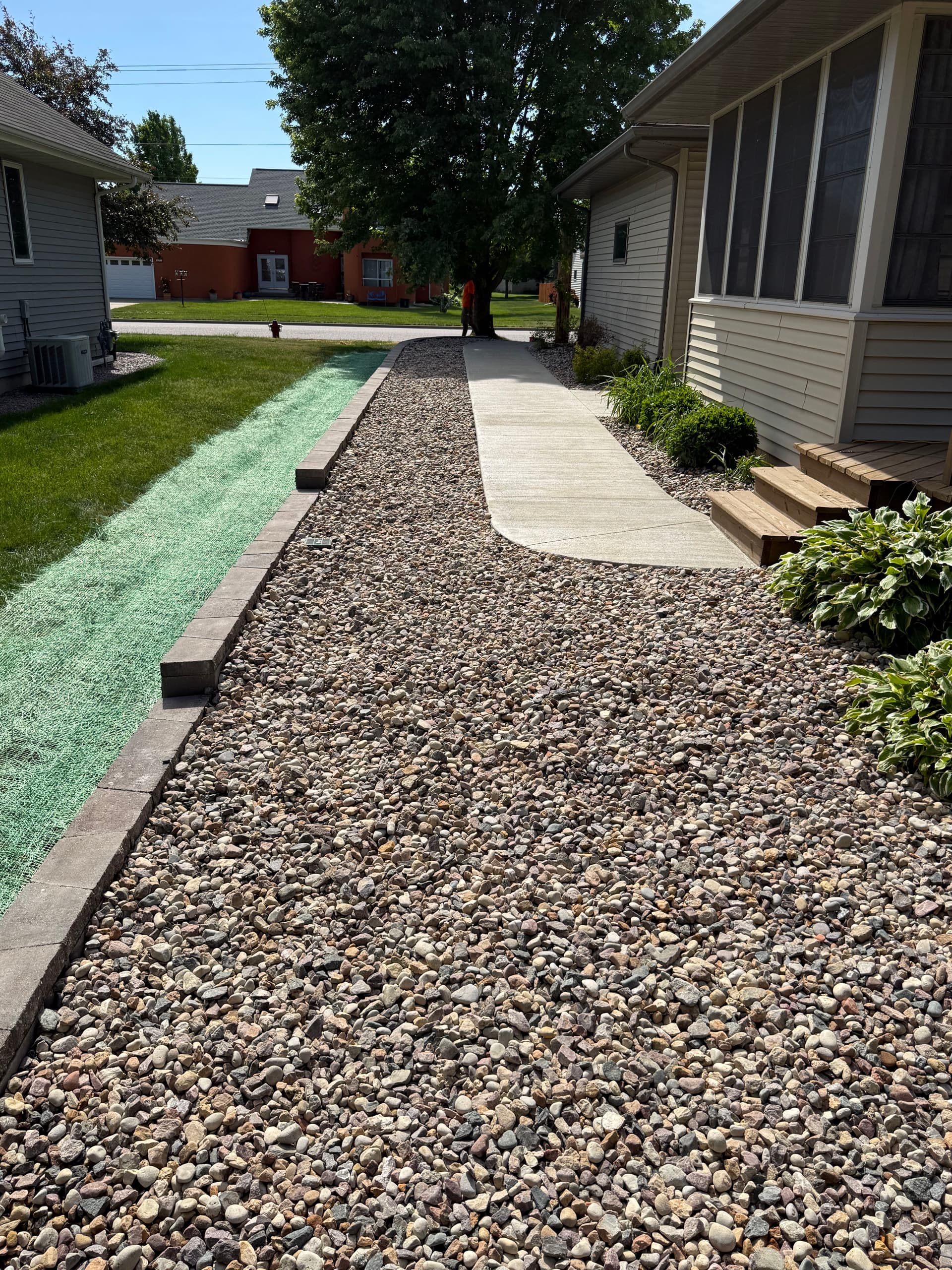70-Foot Concrete Sidewalk with Drainage and Retaining Wall in Sauk City