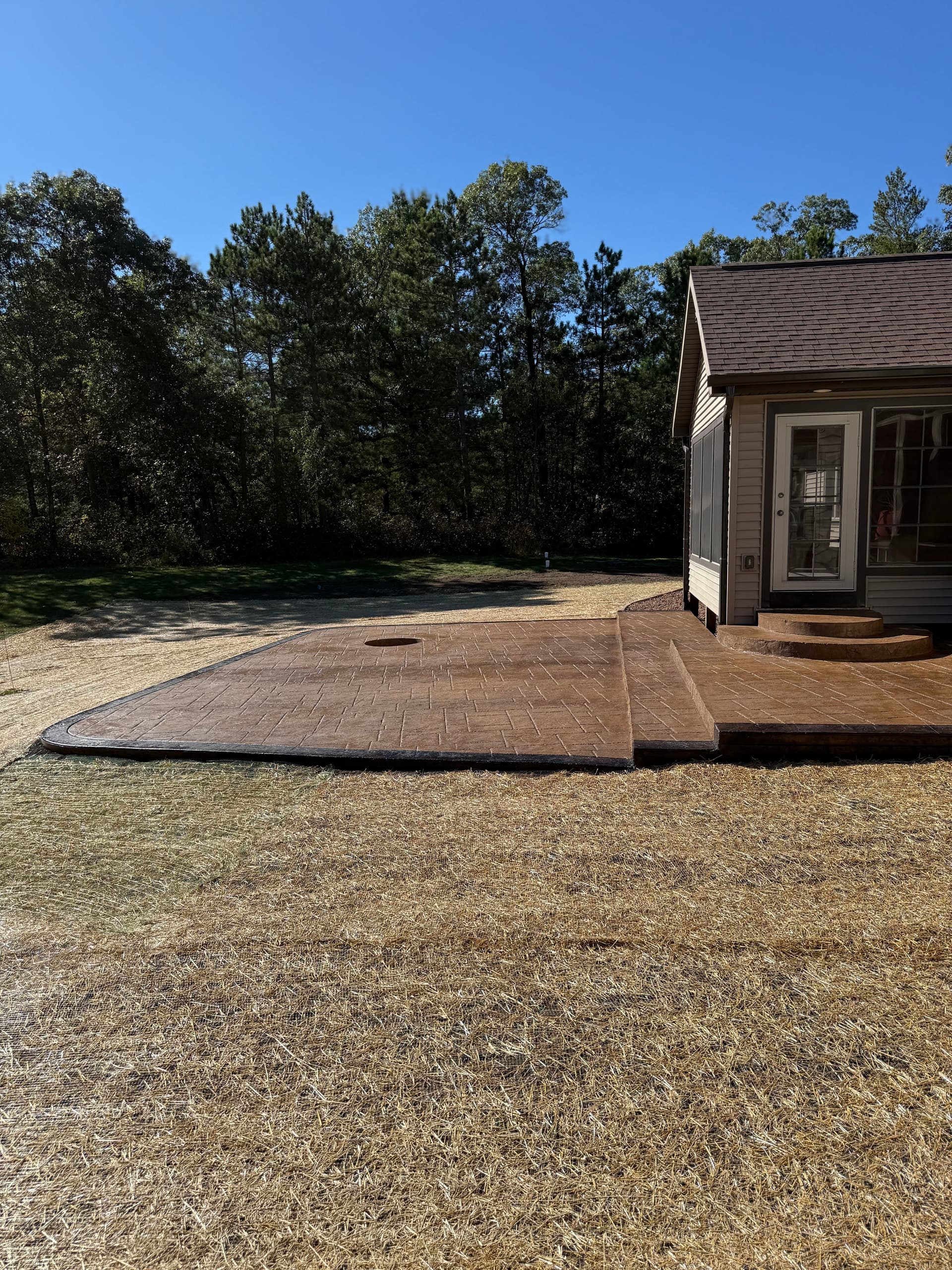 Gallery photos for Custom Stamped Concrete Patio with In-Ground Fire Pit and Two-Tone Border: Image #1